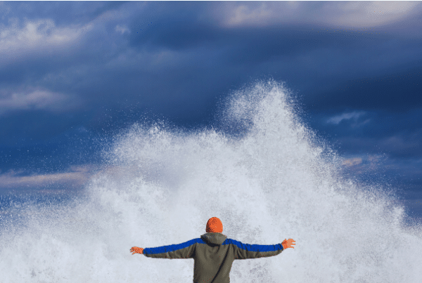 man faces ocean splash